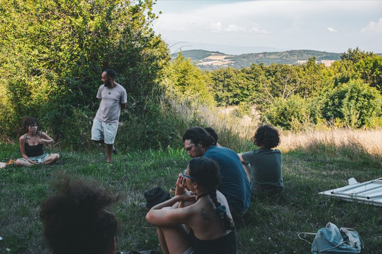 Outdoor participatory circle overlooking the hills
